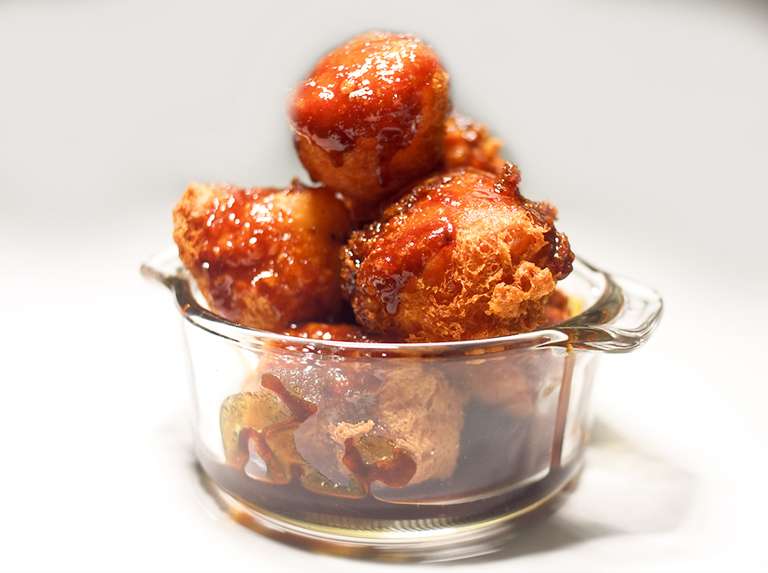 Buñuelos de yuca con melao de papelón